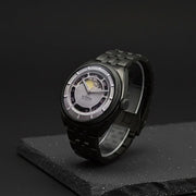Titan 10011QM02 Stellar Cupola watch with silver dial and dark gun stainless steel bracelet, angled product view