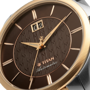 Titan 10076KM03 men's Vetra automatic watch with brown dial and multicoloured stainless steel strap, close-up of the dial