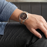 Titan 10076KM03 men's Vetra automatic watch with brown dial and multicoloured stainless steel strap, watch shown on wrist