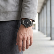 Titan 10077QM01 men's Vetra automatic watch with slate grey dial and grey stainless steel strap, watch shown on wrist