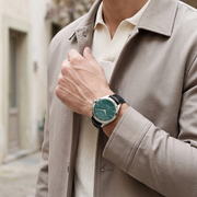 Titan 10077SL03 men's Vetra automatic watch with teal dial and black leather strap, watch shown on wrist
