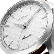 Titan 10077SL05 men's Vetra automatic watch with white dial and brown stainless steel strap, close-up of the dial