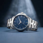 Titan 10077SM01 men's Vetra automatic watch with blue dial and silver stainless steel strap, alternate angled product view