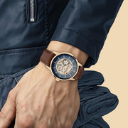 Titan 90110WL06 skeletal automatic blue dial watch shown on a wrist