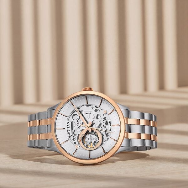 Titan 90140KM01 Metal Mechanicals Analog Watch with Silver Dial and Two-Tone Stainless Steel Strap for Men