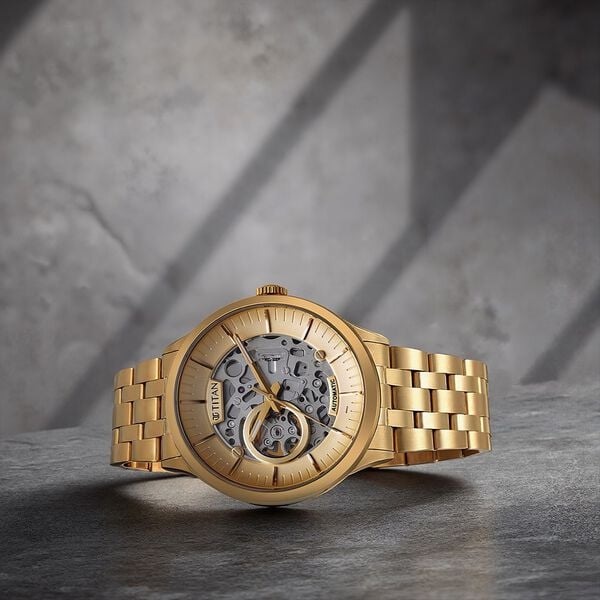 Titan 90140YM01 Metal Mechanicals Analog Watch with Golden Skeleton Dial and Golden Stainless Steel Strap for Men 43mm