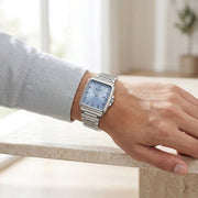 Titan 90260SM01 blue dial watch with silver strap, watch shown worn on the wrist