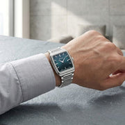Titan 90260SM02 green dial watch with silver strap, watch shown worn on the wrist