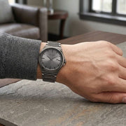 Titan 90261QM02 grey dial watch with grey strap, watch shown worn on the wrist