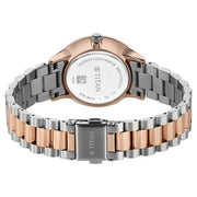 Titan 95247KM03 white dial watch with brown strap, side view showing the case profile and strap